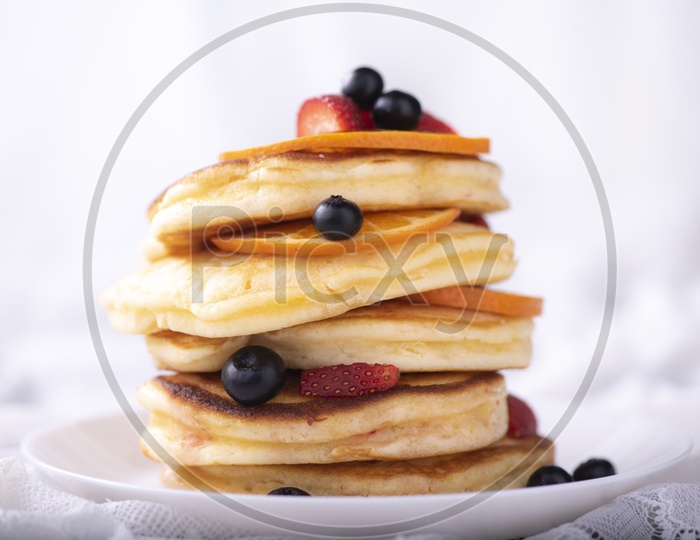 A Morning breakfast served with pancake stack and berries