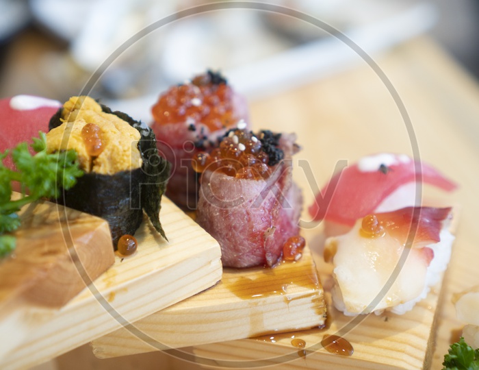 Sushi Shashimi Japanese Food or Dish Served in Restaurant With Wooden Table Background