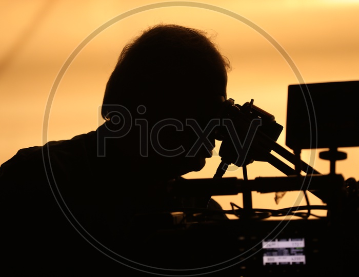 Silhouette of a Cinematographer Looking into Camera