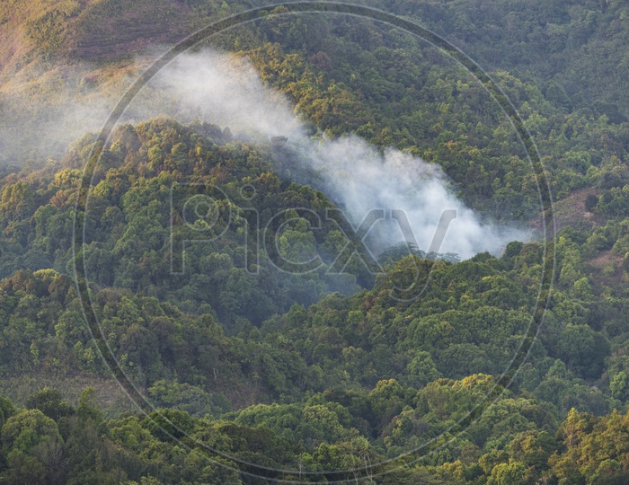 landscape view of mountains and smoke
