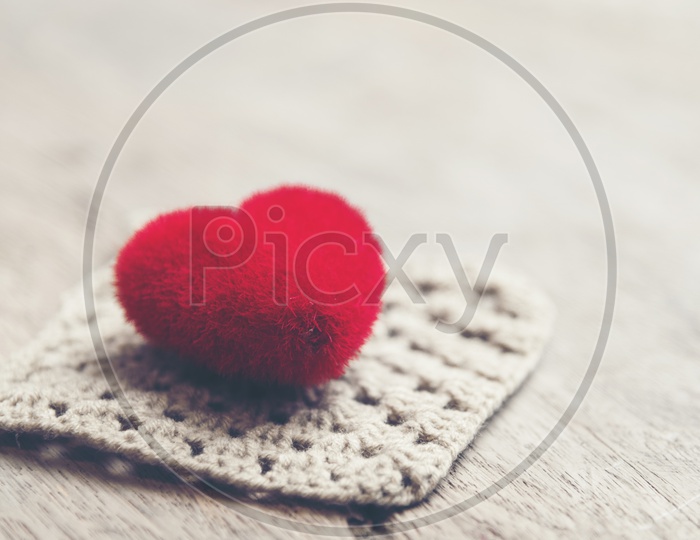 Red Heart Shape On a Vintage Wooden  Table  For Valentines Day Concept