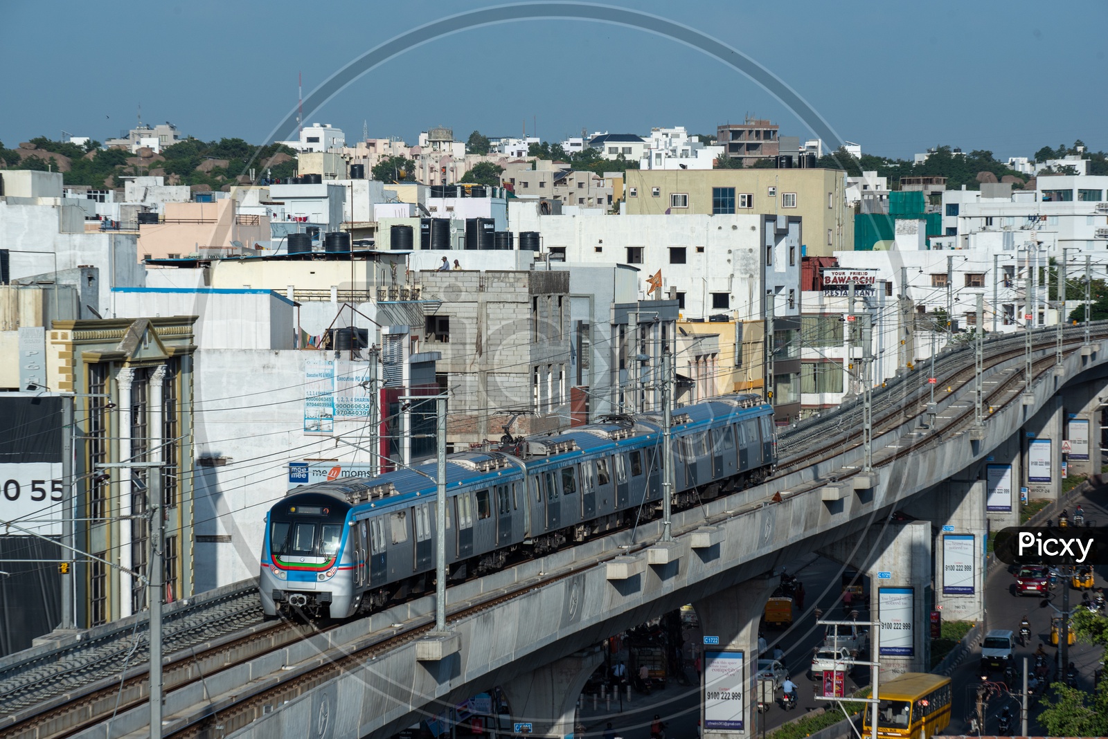 Metro train Running On Track With City scape In Background