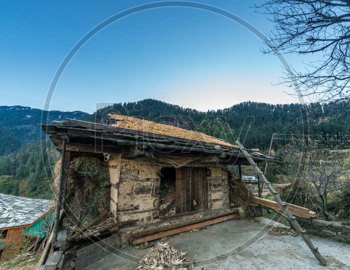 A damaged wooden alpine house in Manali