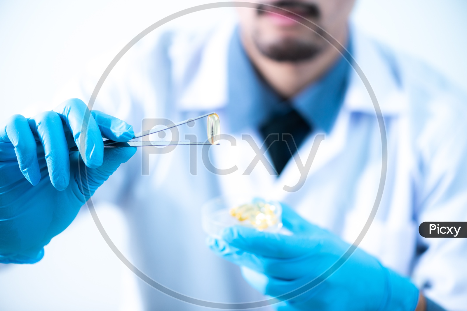 Young Asian Male Scientist Holding Fish Oil Pill Or Capsule In Hand, Healthy Nutrition