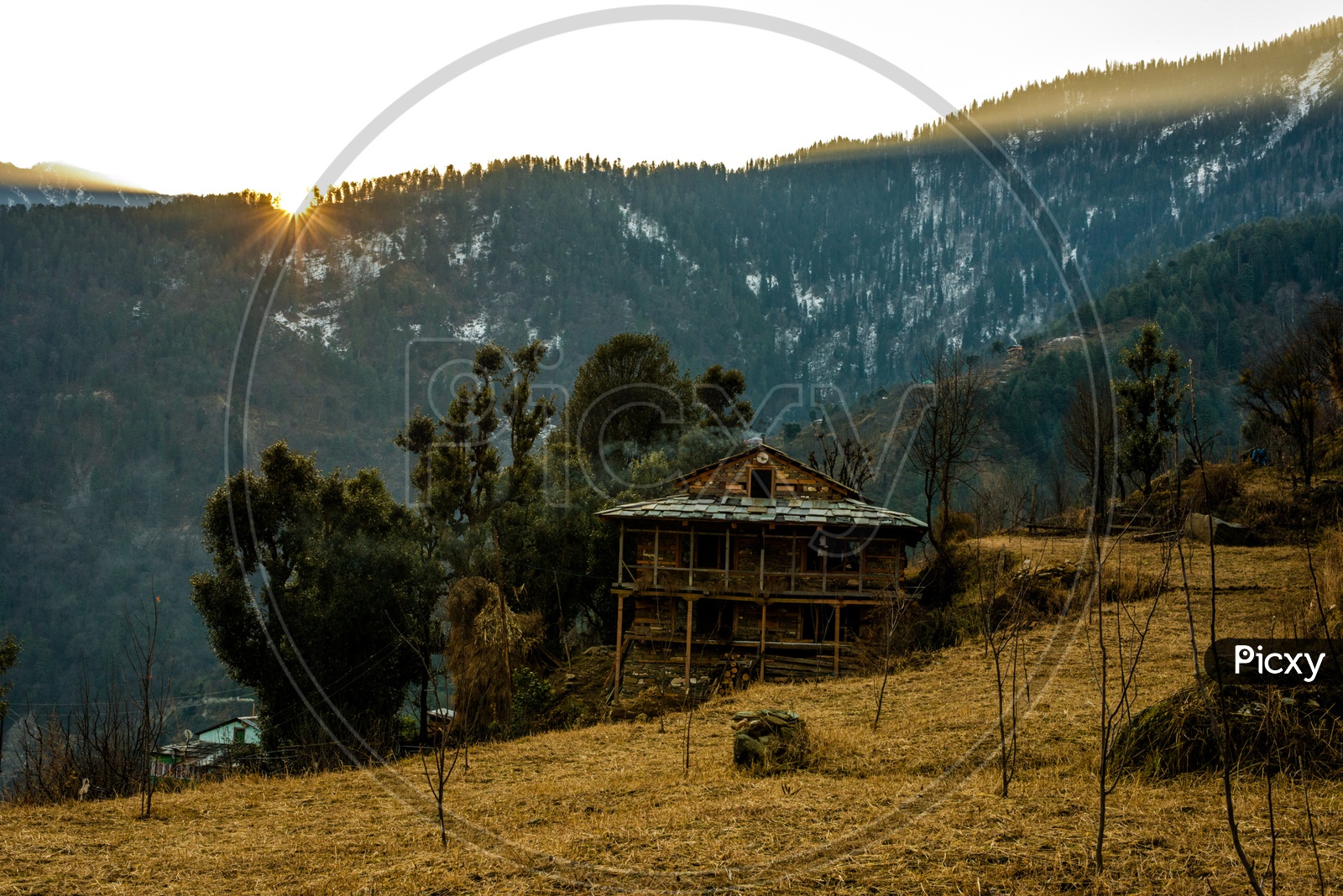 Typical wooden alpine house in himachal in himalayas With Mountains In Background