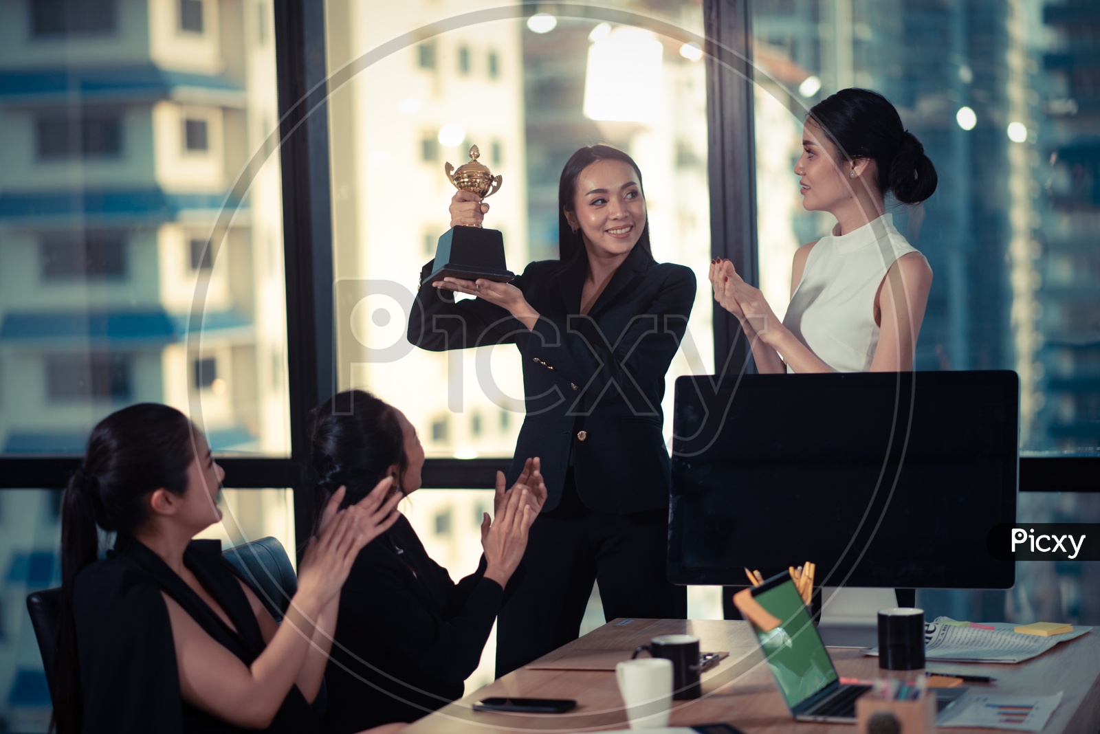 Young Asian Woman Holding Trophy in Hand, Successful or Achievement Concept