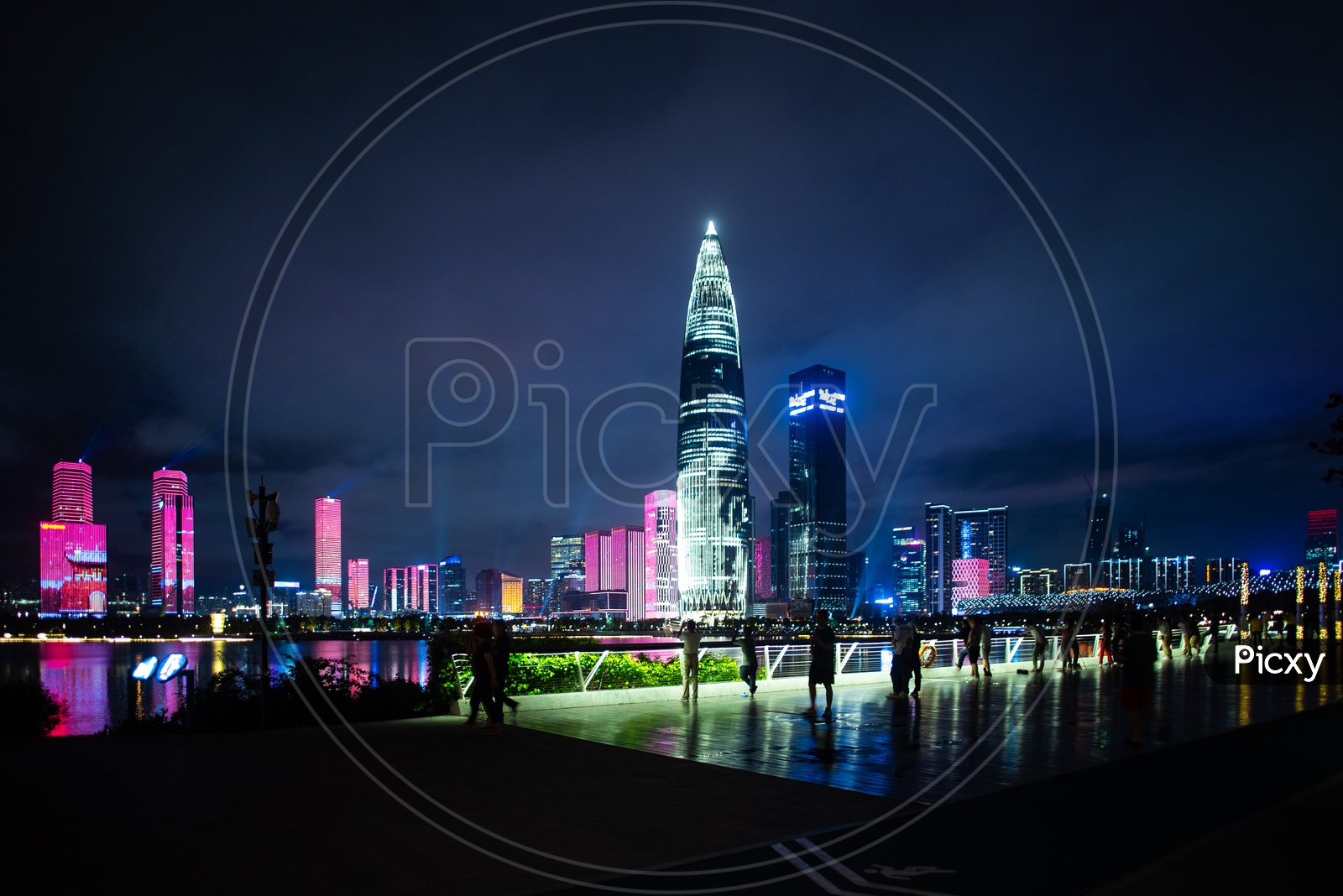 Tourists enjoying the view of Shenzhen city skyline night scenery in China