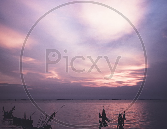 Sunset hues over the local fishing boats in Thailand