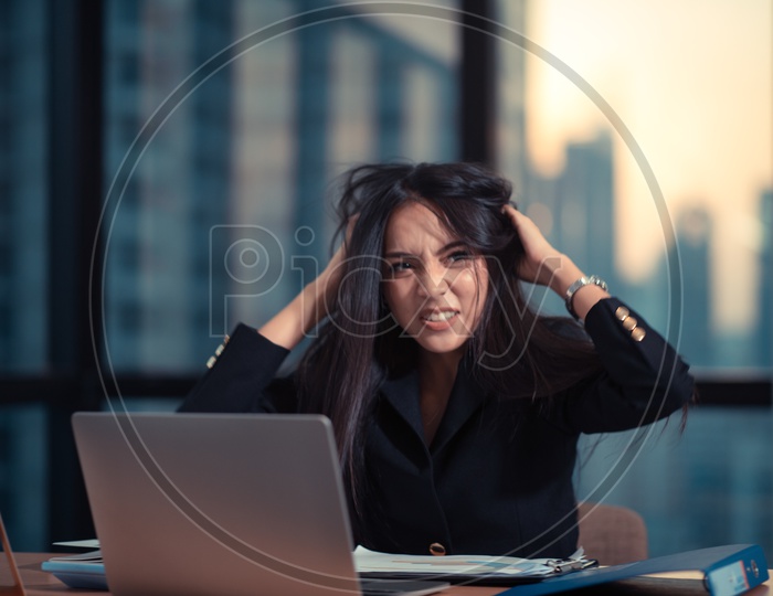 Young Asian Businesswoman frustrated and stressed about failure