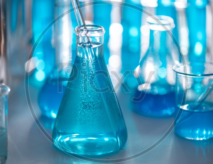 Chemical research with blue solution in the laboratory
