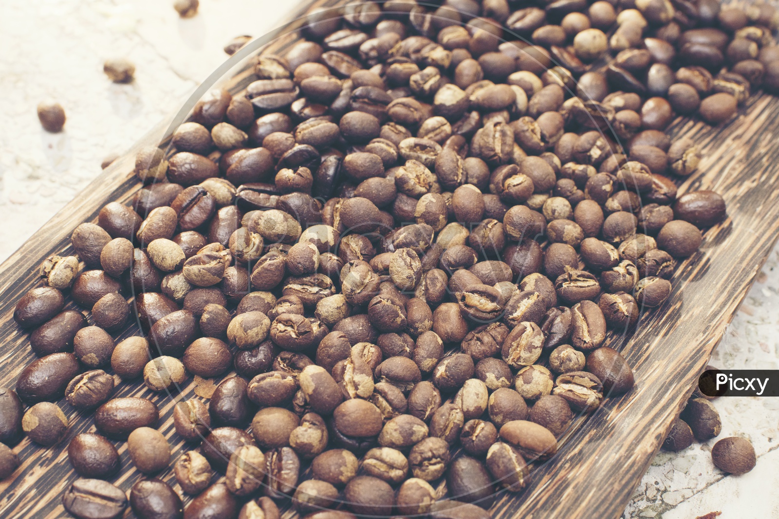Coffee Beans on Wooden Background