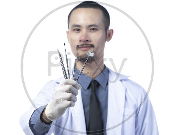 Asian Male Dentist Doctor with Dental tools isolated on white background