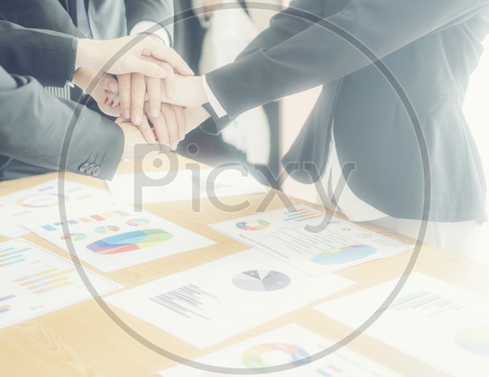 Close up of business people hands together - Corporate Meeting Teamwork Concept - With hot light