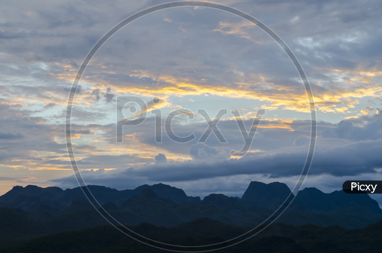 Sunset Sky With Clouds over Mountains Backdrop
