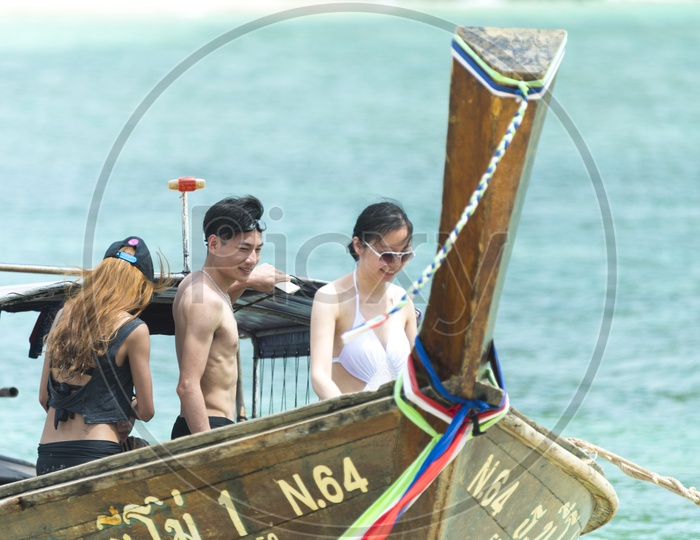 Tourists Enjoying The Boat Rides At Krabi Beach in Thailand