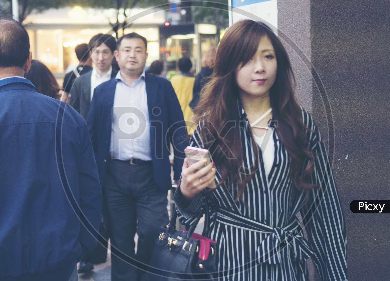 Japanese people walking in the streets in Fukuoka, Japan