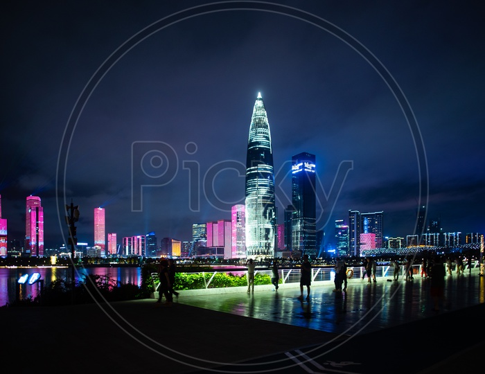 Tourists enjoying the view of Shenzhen city skyline night scenery in China