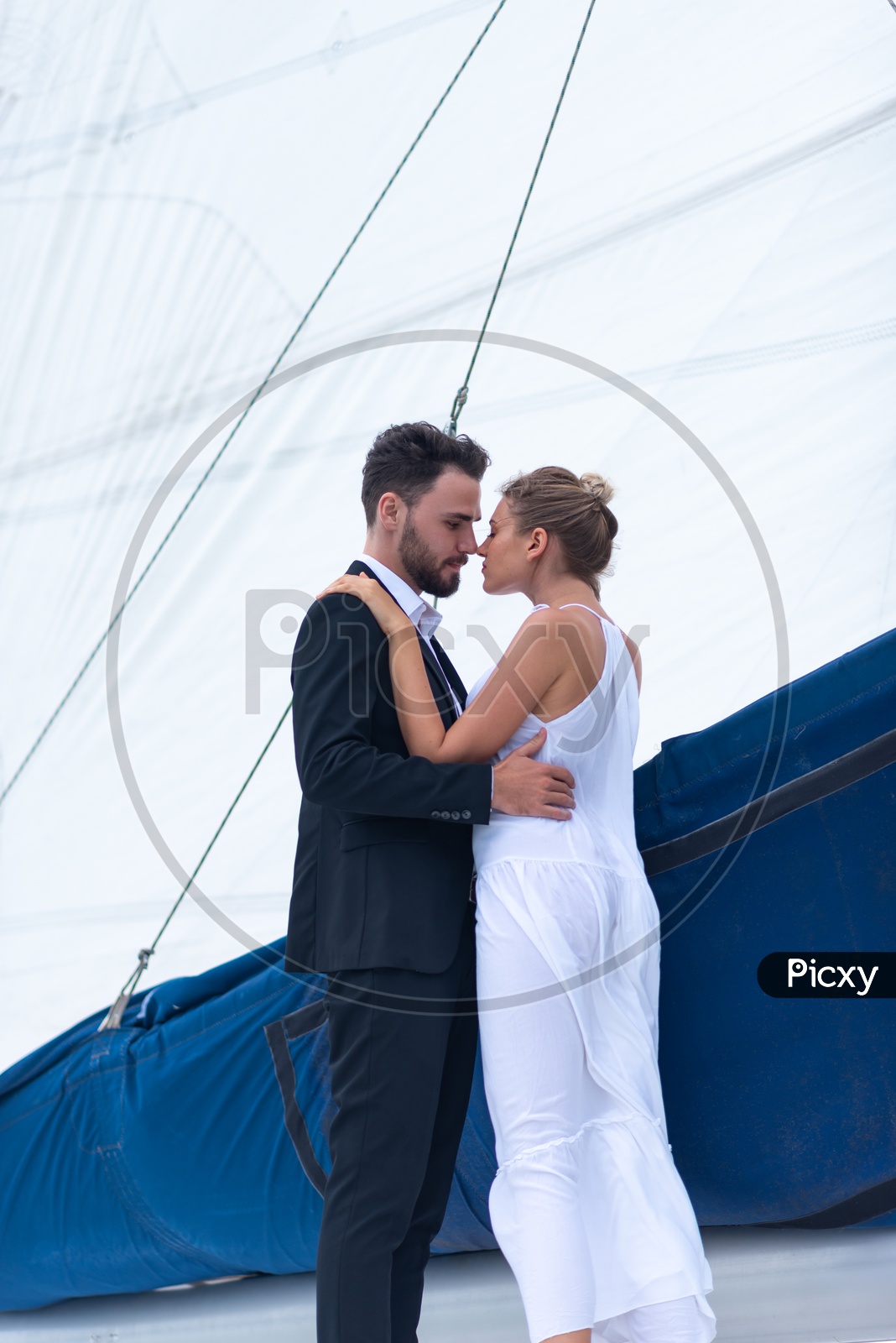 Young Couple Celebrating  Wedding Anniversary on a yacht, Honeymoon Trip