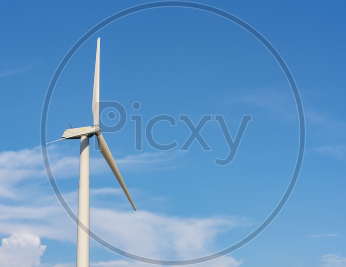 Wind Turbine with Blue Sky in Background, Renewable Energy Concept