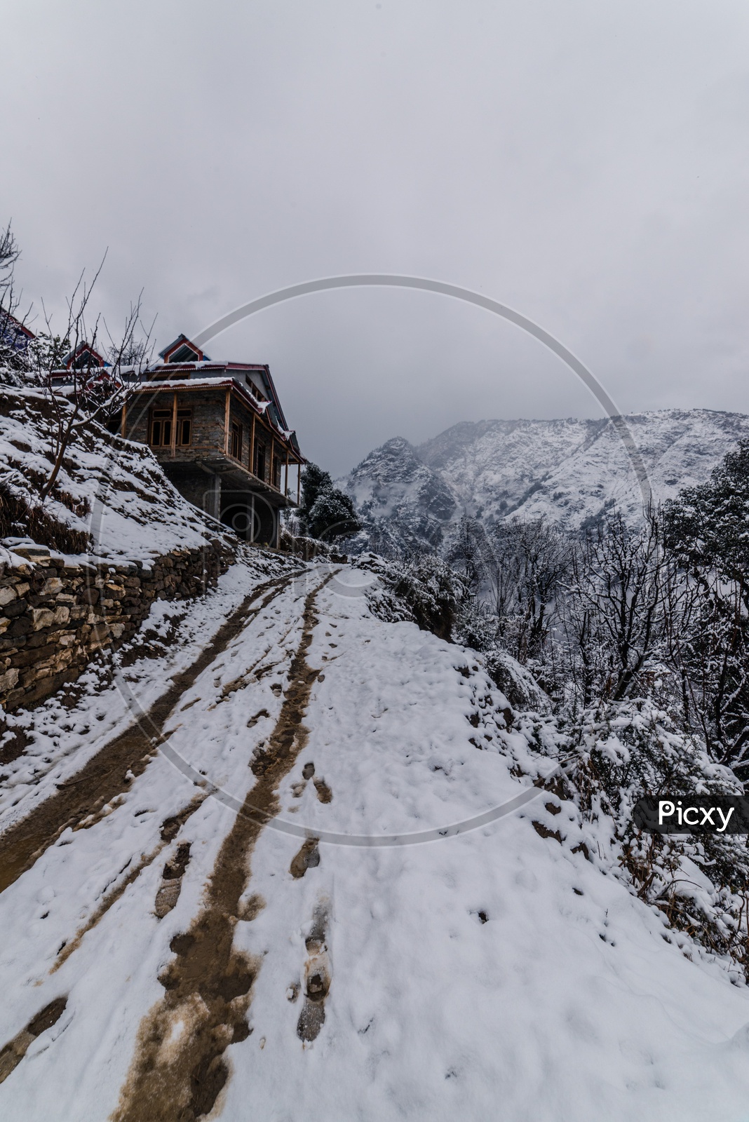 Snow covered wooden house in himalayas in winter Season