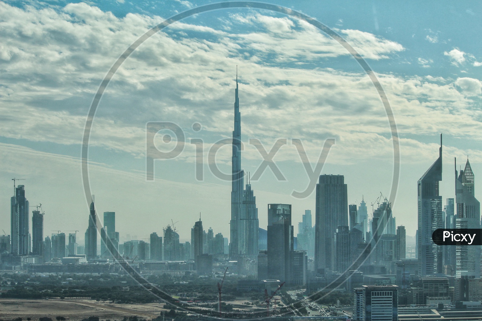 Clouds over Burj Khalifa and other buildings in Dubai