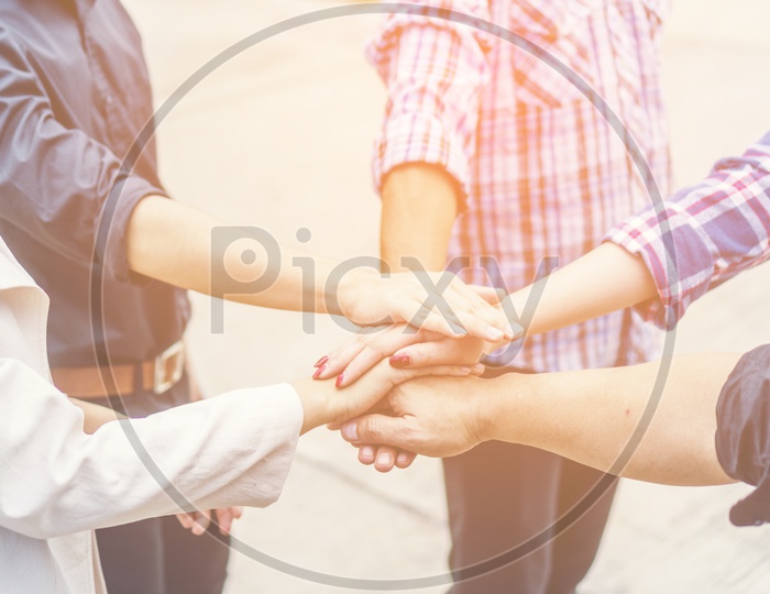 Group of business people with crossed arms in pile