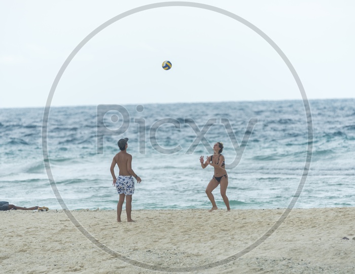 Tourists Playing Beach volleyball  in Phuket beach