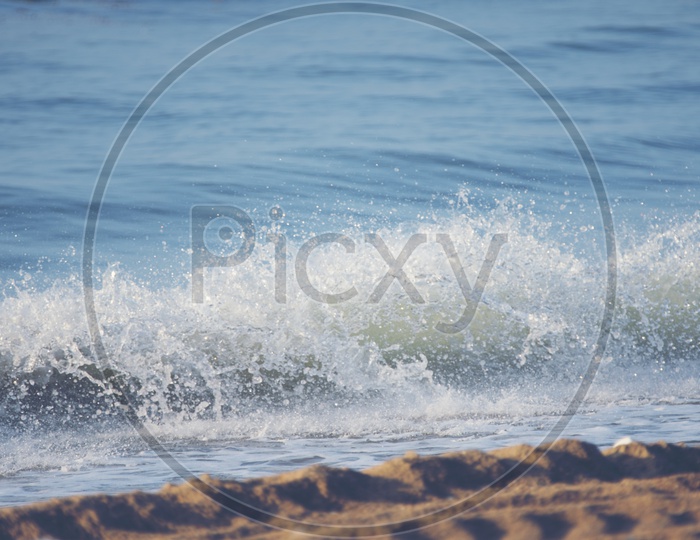 Ocean Waves breaking sand beach