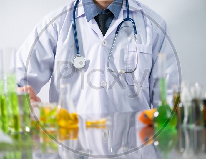 Young Asian Scientist with Stethoscope at Laboratory