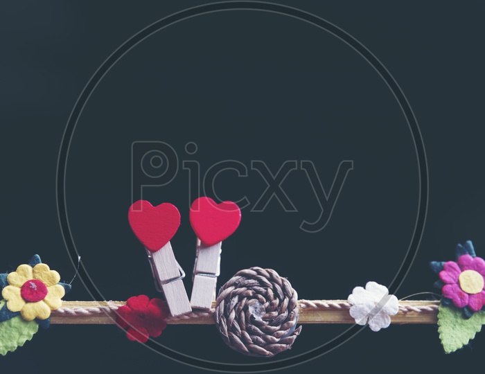 Valentines Day Love Concept With Red hearts Hung On an Isolated Black Background