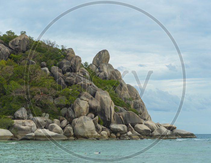 tropical sea Scape With Rock Hill island And Blue Sea Water