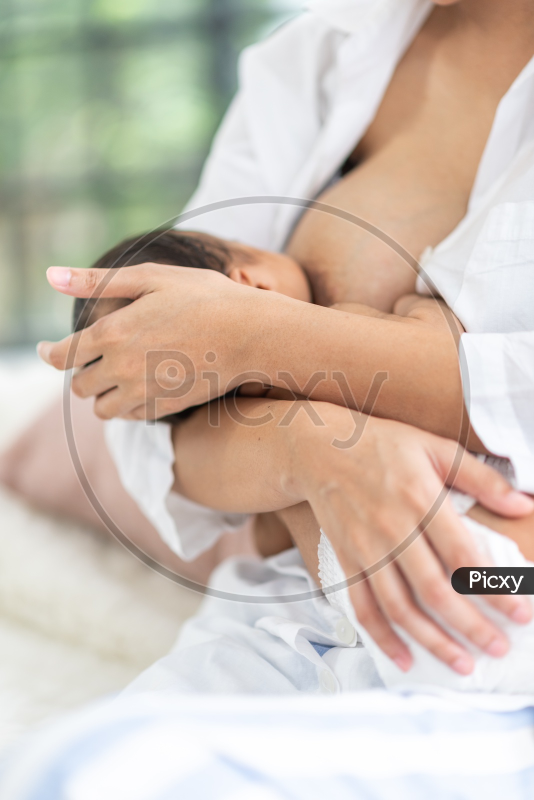 Closeup of Asian Mother breastfeeding her baby