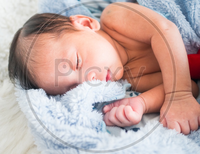 1 month old baby boy is sleeping