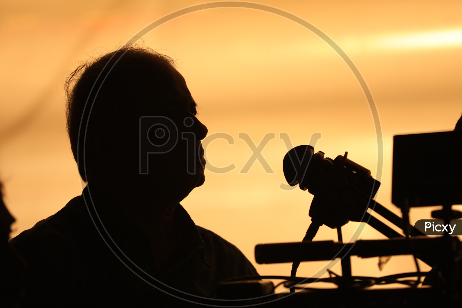 Silhouette of a Cameraman working for a Movie