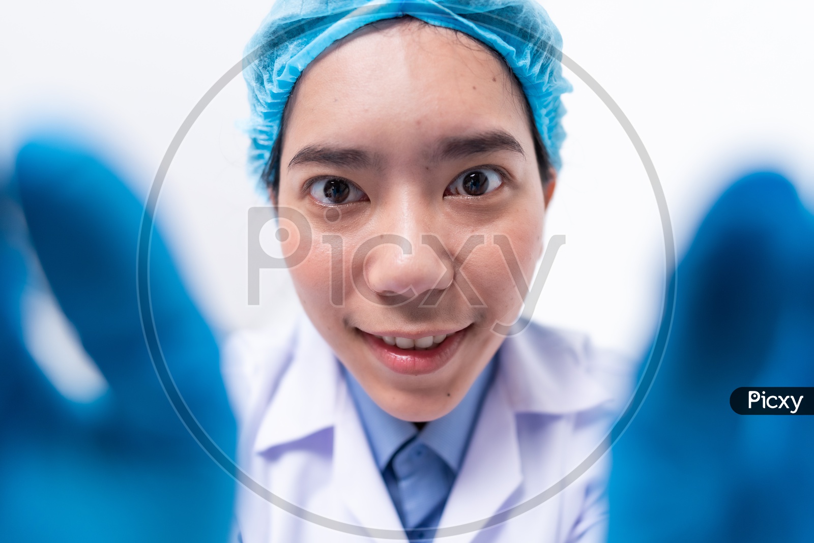 A young scientist with hair mask in the laboratory