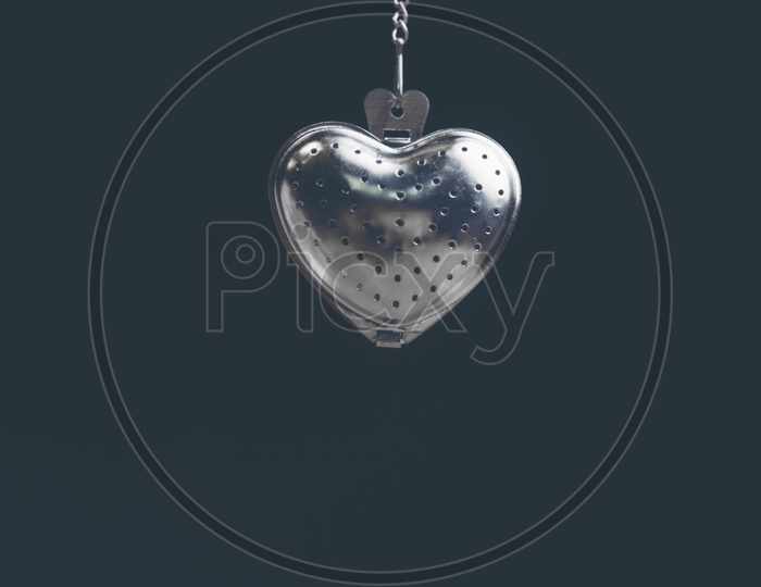 Heart shaped stainless steel locket with black background