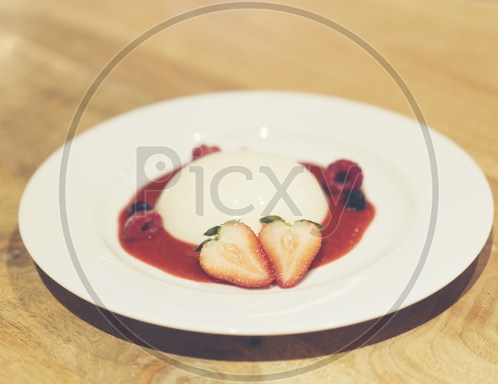 Italian Dessert Panna Cotta With Strawberry  and Jam Served At  a Cafe