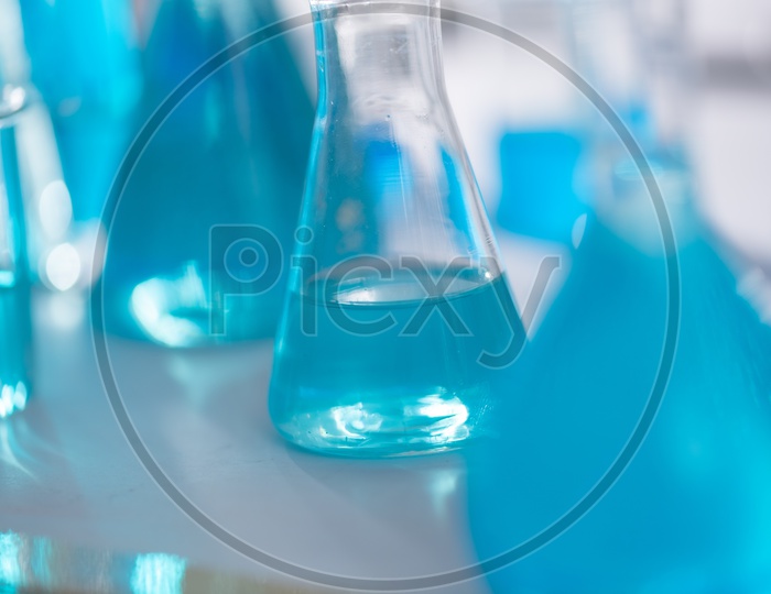 Conical Flask containing blue liquid in chemical laboratory