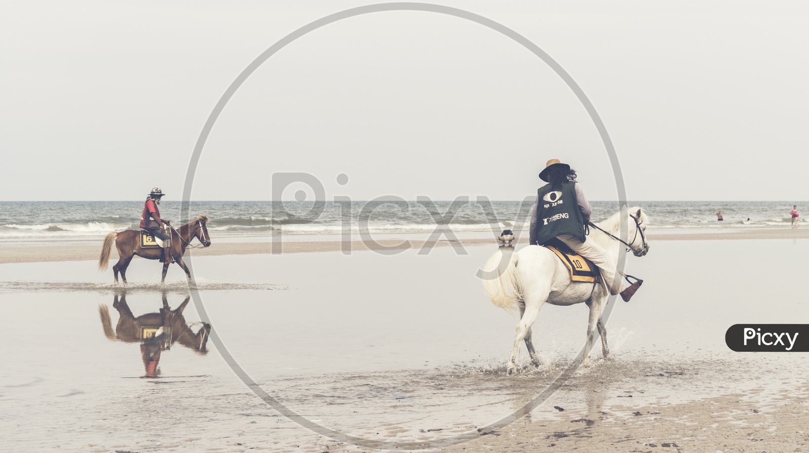 Tourists Riding Horse on beach at Hua Hin Beach, Thailand