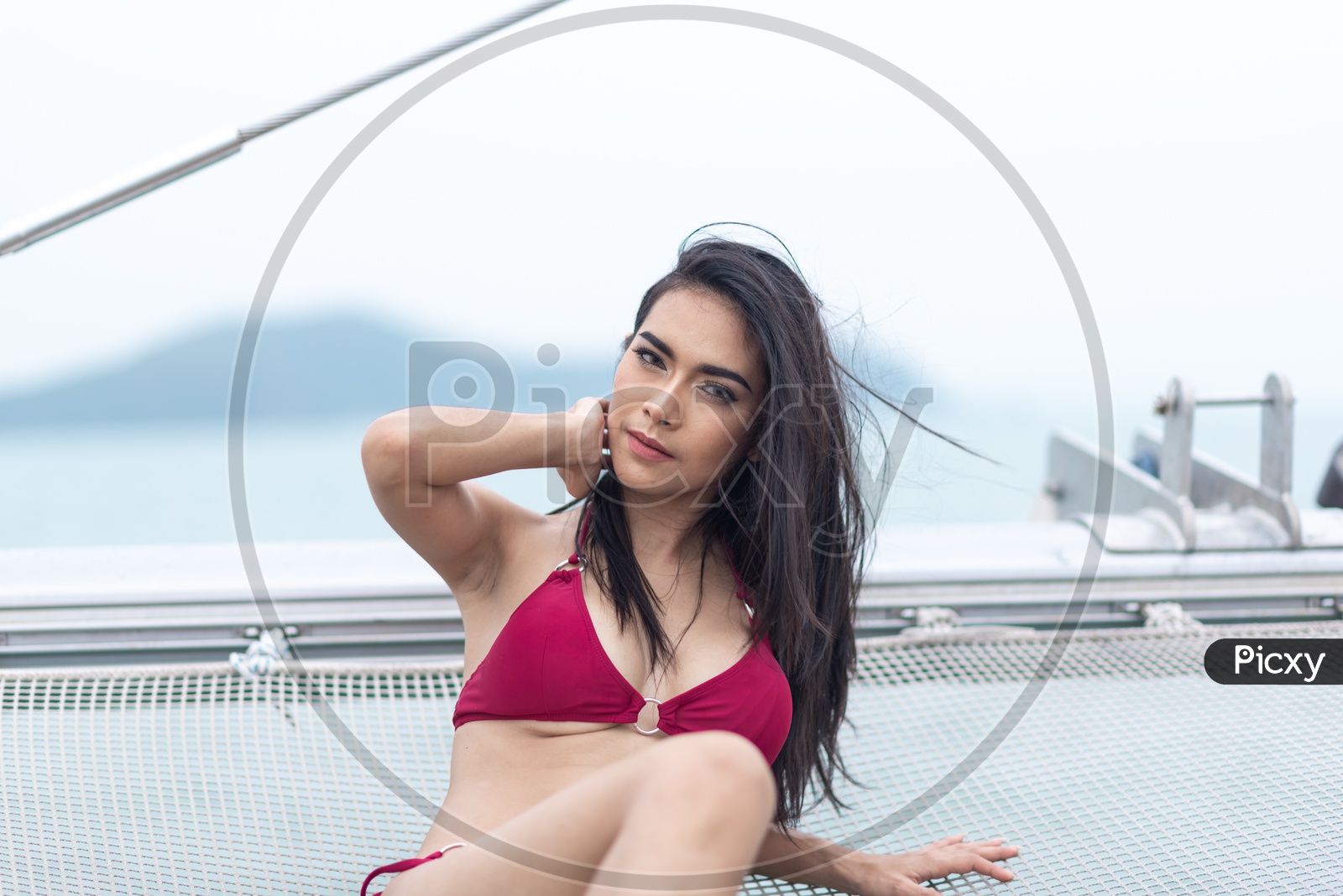 Image of Sexy Asian Beautiful girl in Red Bikini on a yacht in  Sea-YL678537-Picxy