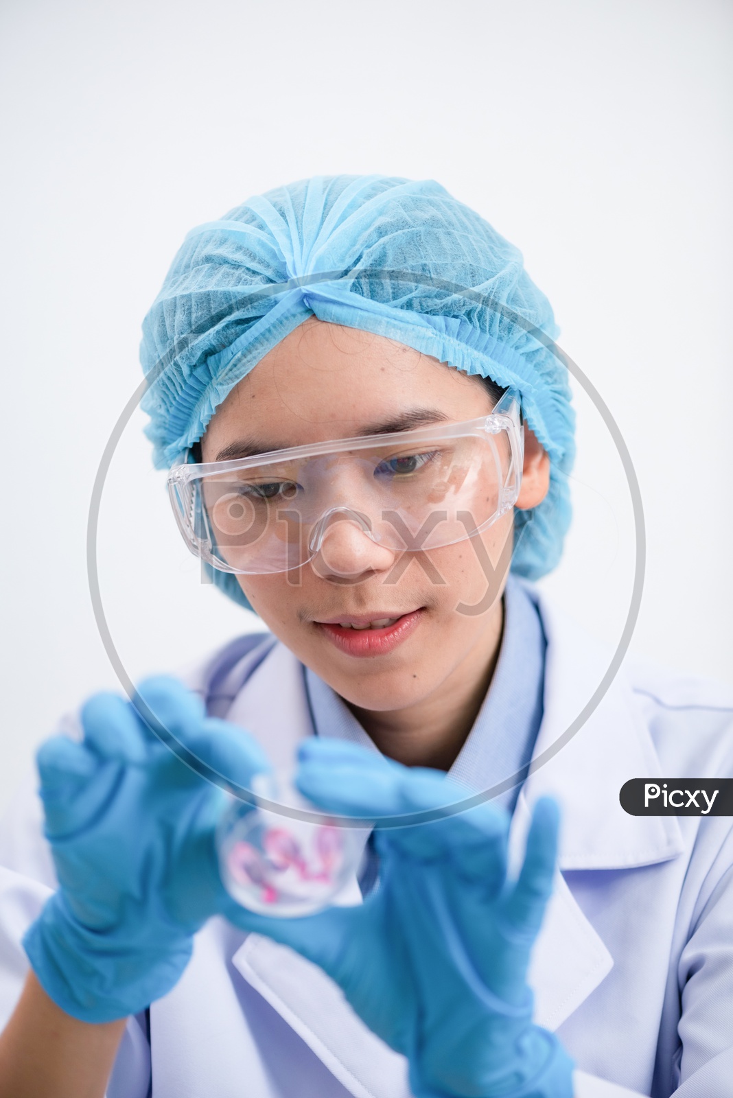 Young Asian Woman Scientist Holding Fish oil Pill or Capsule in Hand, Healthy Nutrition