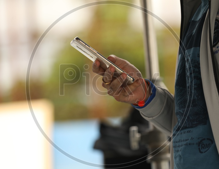 A Mobile Phone in the hands of a man