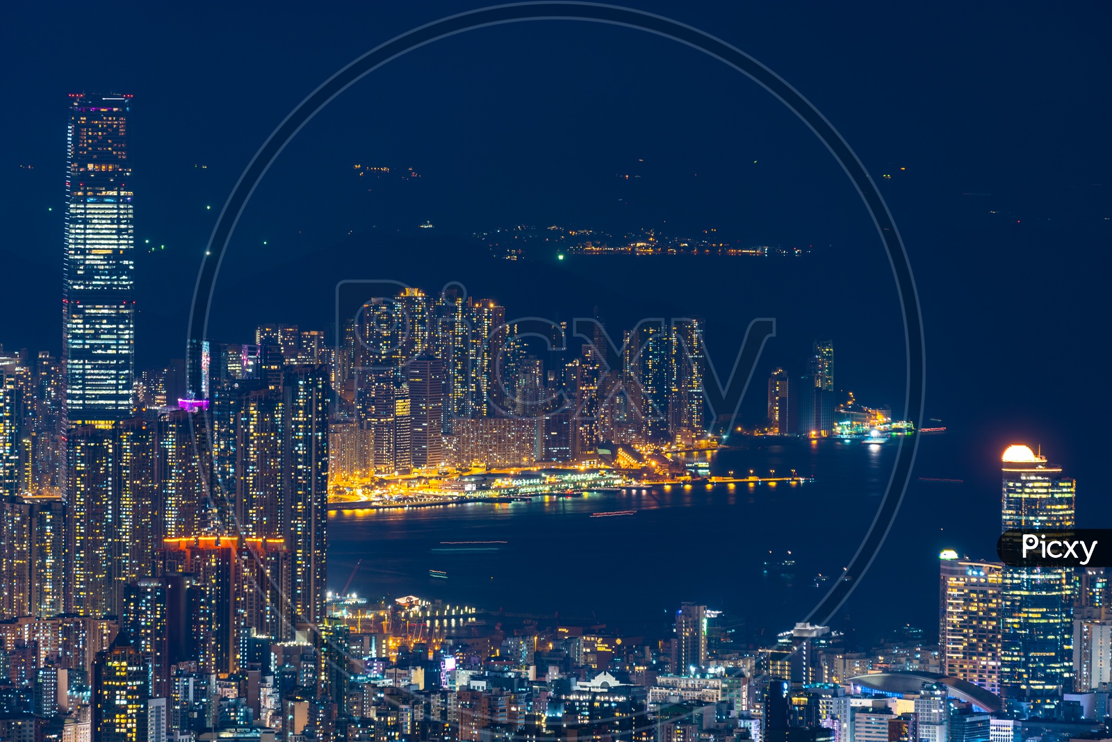 Hong Kong cityscape at night alongside Port area