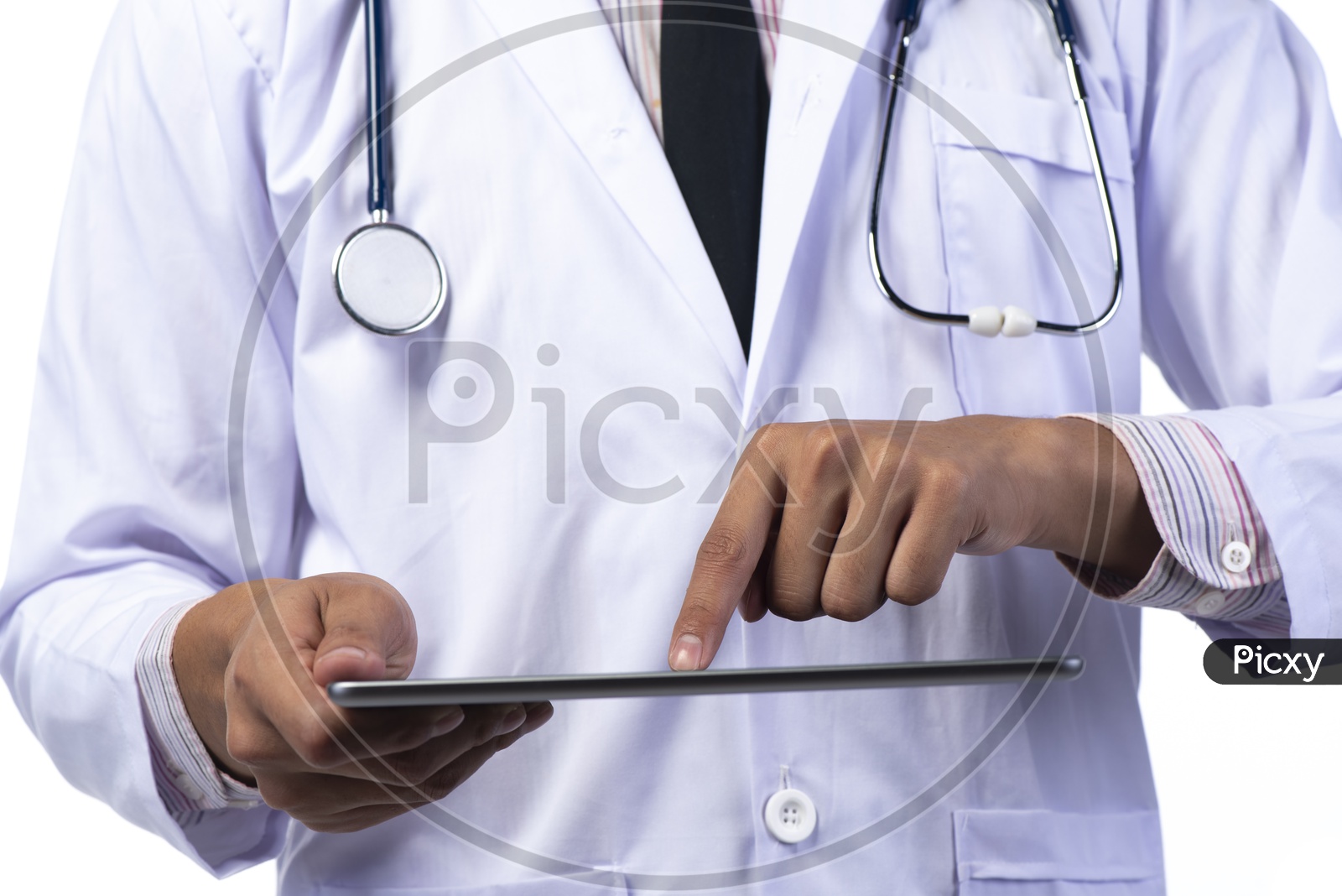 Doctor with White Apron and stethoscope using Tablet or iPad