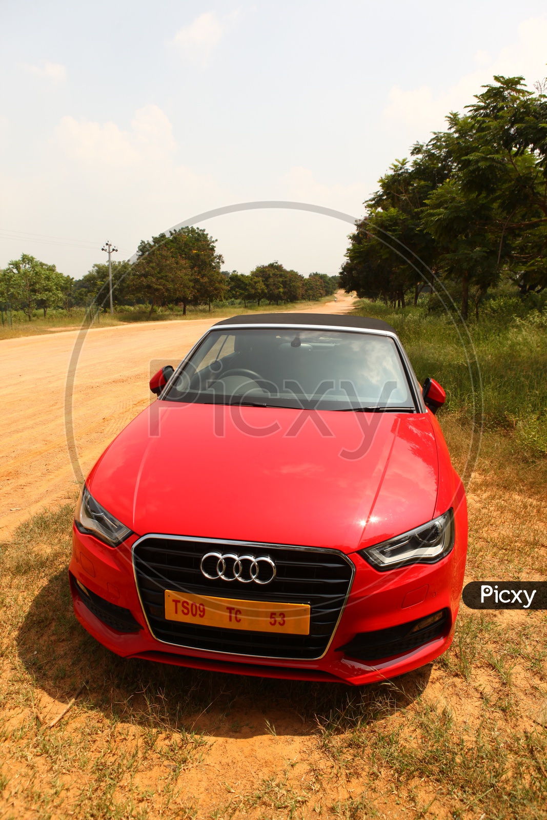 Red Color Audi A3 Cabriolet Car on Country Road