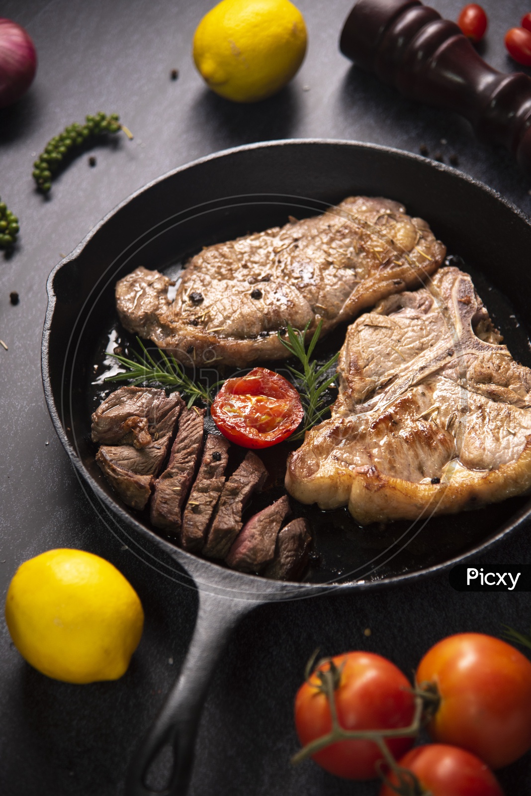 Colorful beef steaks and vegetable steaks in Black Pan