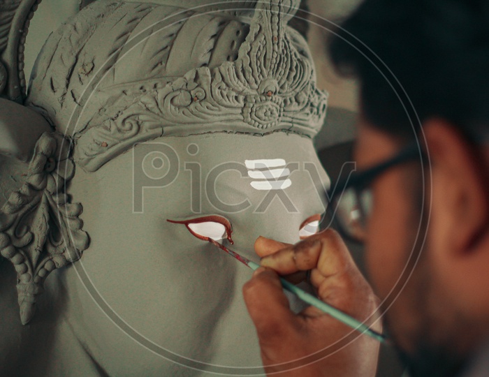 Painting the eyes of lord ganesh