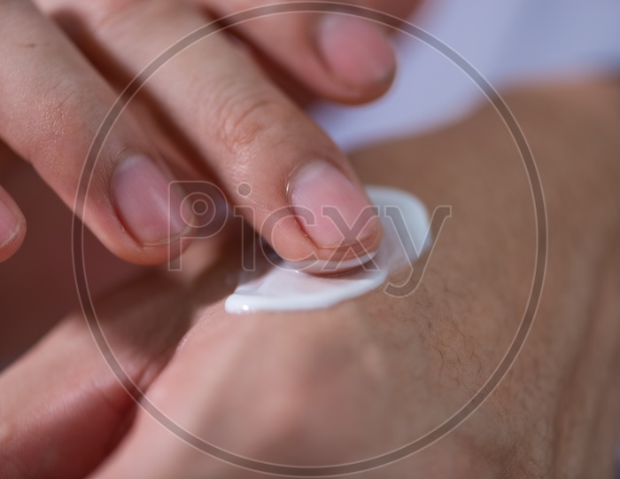 Asian Research Scientist Testing Skin for the development of Cosmetics