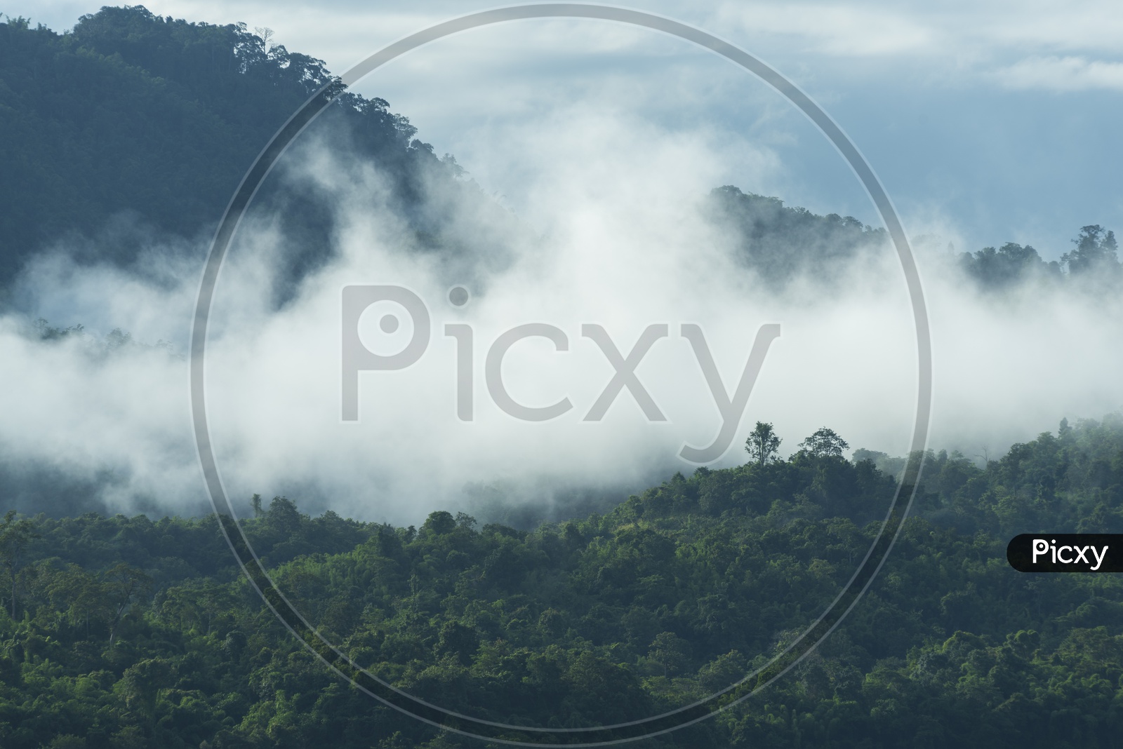 Landscape With Foggy Clouds Over Tropical Forest Mountains  In Thailand