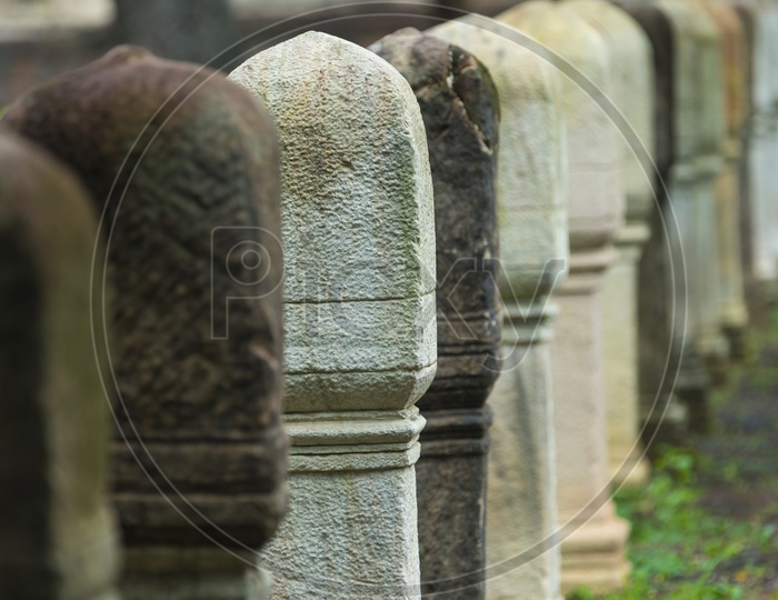 Railing Pillars Carved With Stones At Ancient Buddha temple in Thailand